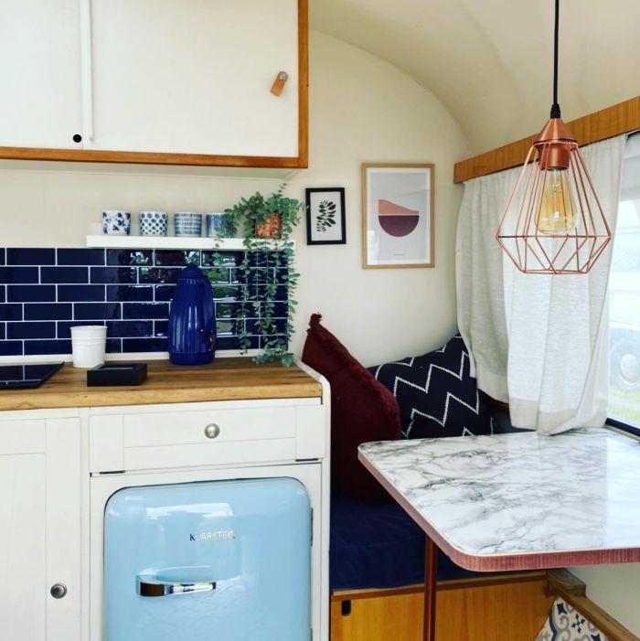 Beach camper with kitchen and sitting area at the Stover Strand campsite near Hamburg
