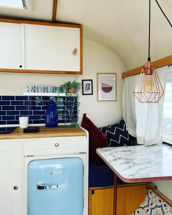 Kitchen and seating area in retro motorhome at Stover Strand campsite near Hamburg. 