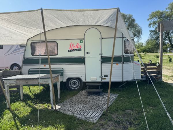 Retro camper with awning at the Stover Strand caravan park