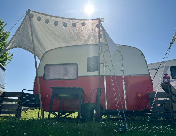 Red and white retro camper at the Stover Strand campsite near Hamburg