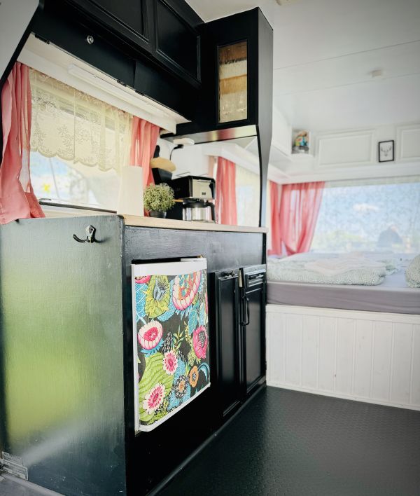 Camper with black kitchen at the Stover Strand caravan park near Hamburg