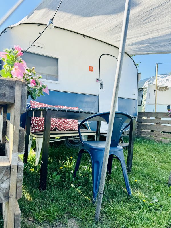 Dark blue retro camper at the Stover Strand campsite near Hamburg