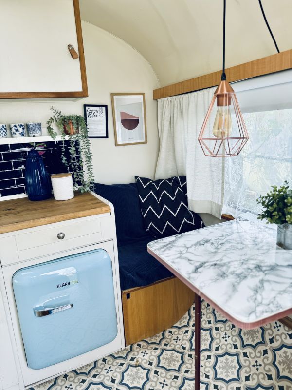 Retro camper with modern kitchen and sitting area for Elbe camping near Hamburg