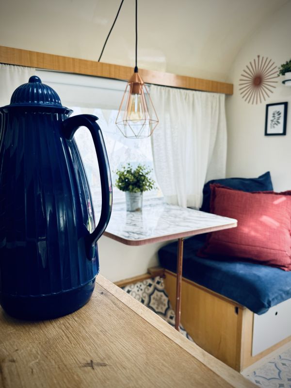 Retro camper with sitting area for Elbe camping near Hamburg