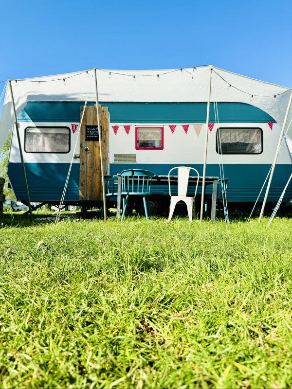 White turquoise retro camper right on the Hamburg campsite Stover Strand