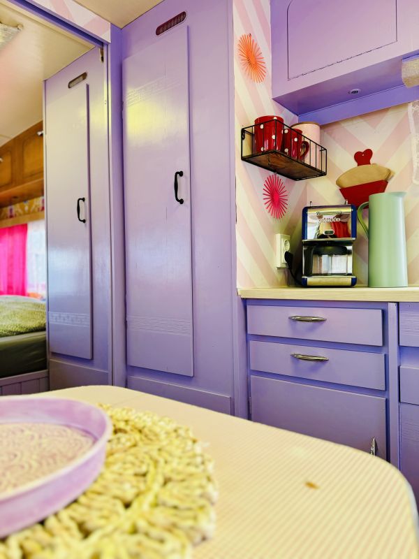 Retro caravan with purple kitchen at the Stover Strand campsite near Hamburg