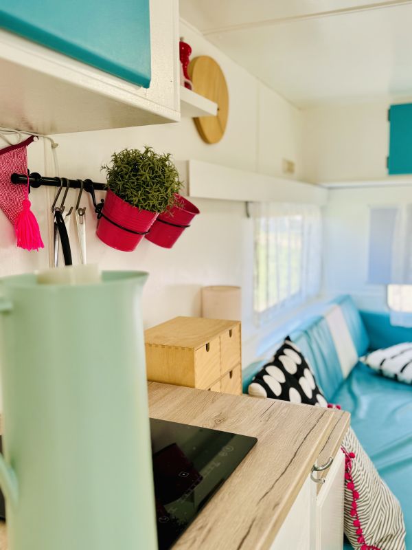 Retro camper with sitting area and kitchen at the Stover Strand caravan park