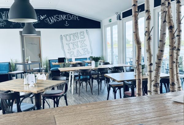 Dining room of the restaurant on the houseboat at Stover Strand near Hamburg